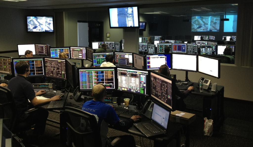 a group of people sitting at computers